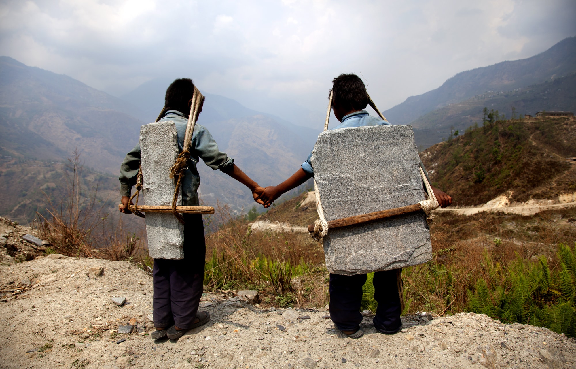 Brothers Carrying stones in Nepal