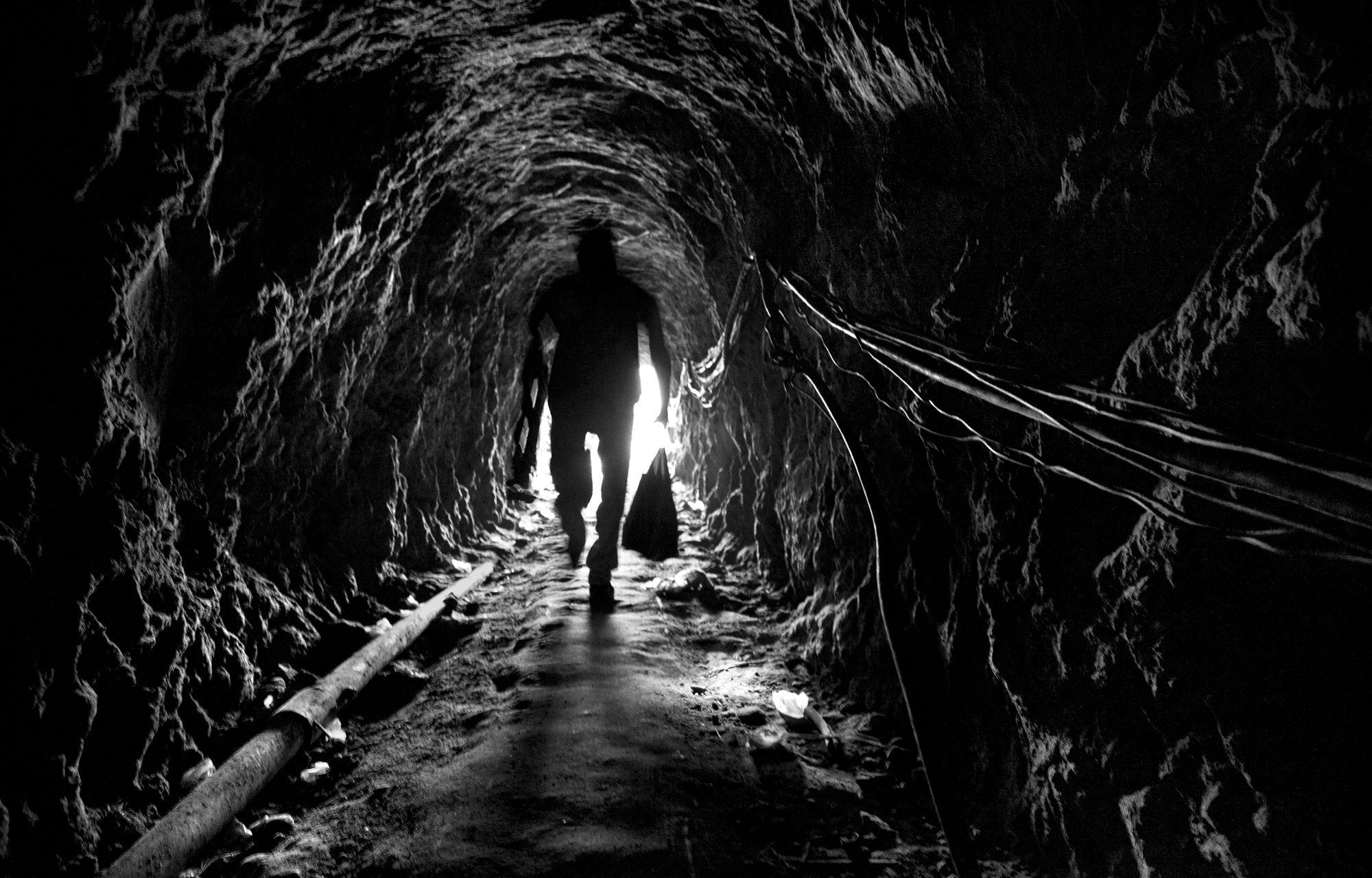 Man walking through a cave in Nepal