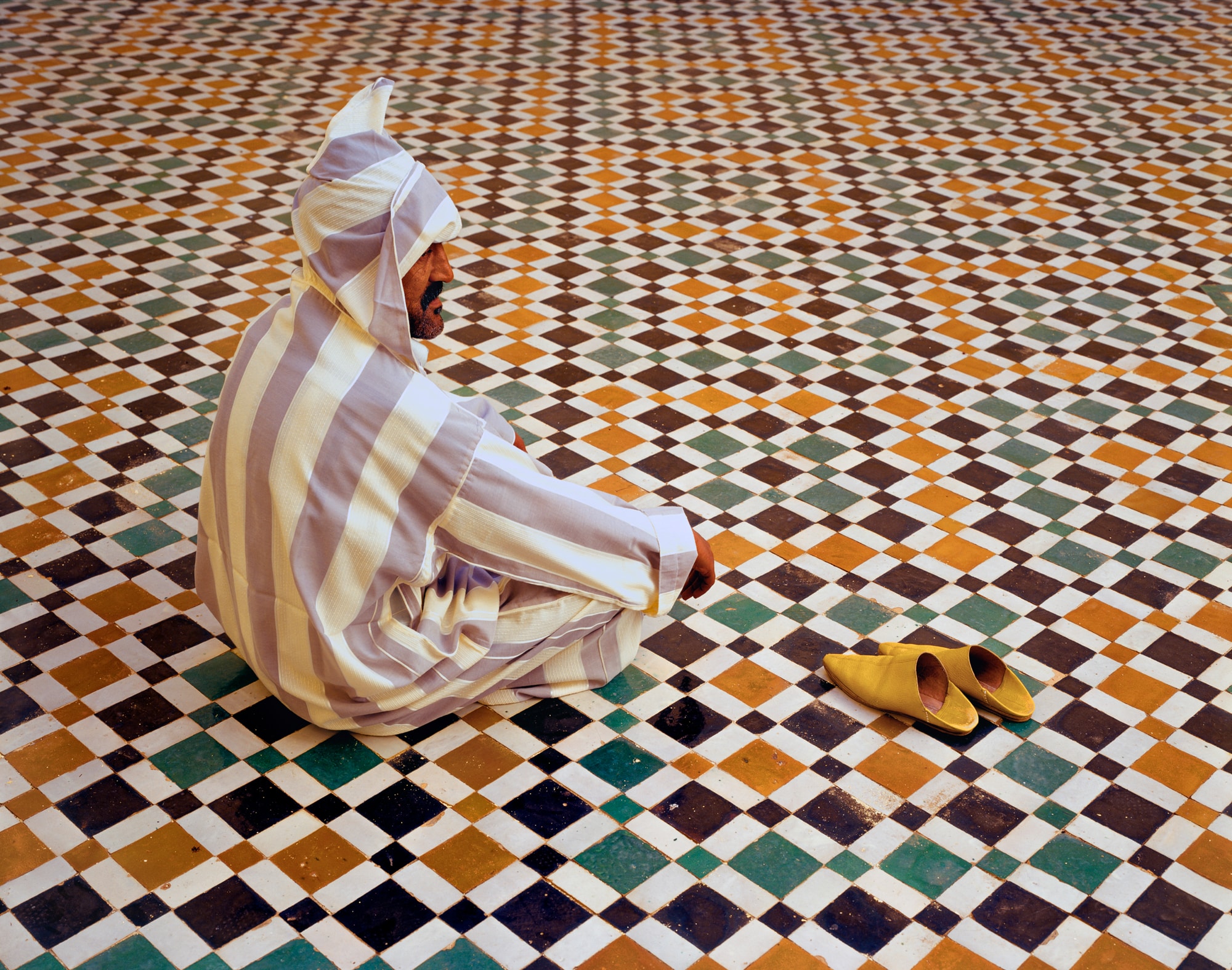 This man was on a work break, as guardians at the Mausoleum of Moulay Isma’il. The cadence of the patterns and colors—the repeating diamond shapes and the camaraderie of brown, green and mustard yellow—make up a mosaic you can get lost in.