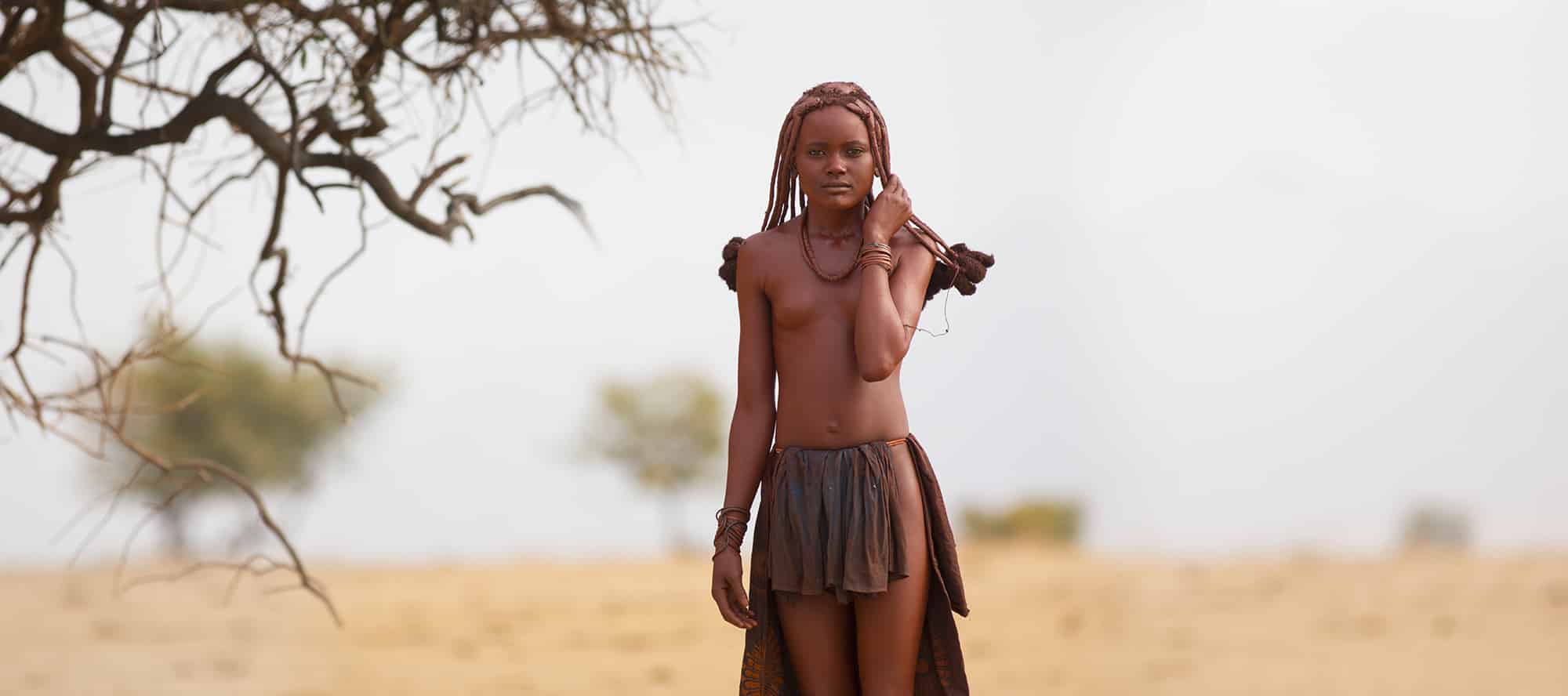 Small girl beneath the branches in Namibia