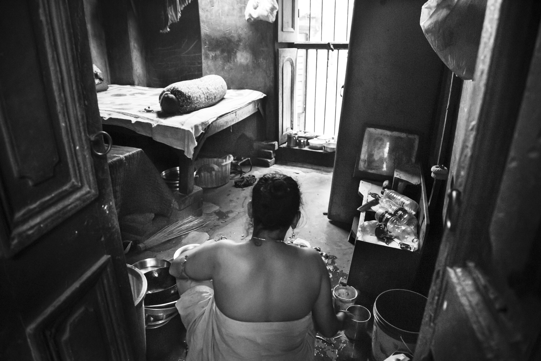 Women sitting in a room in a brothel in India