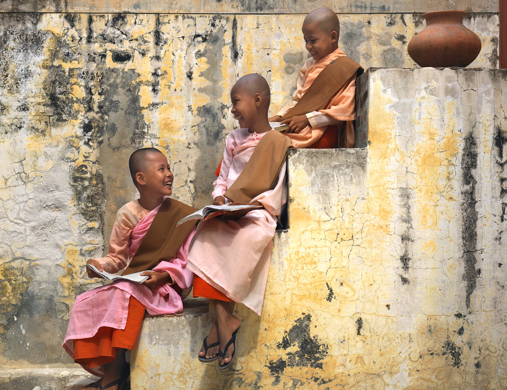 Young monks reading on a stair well