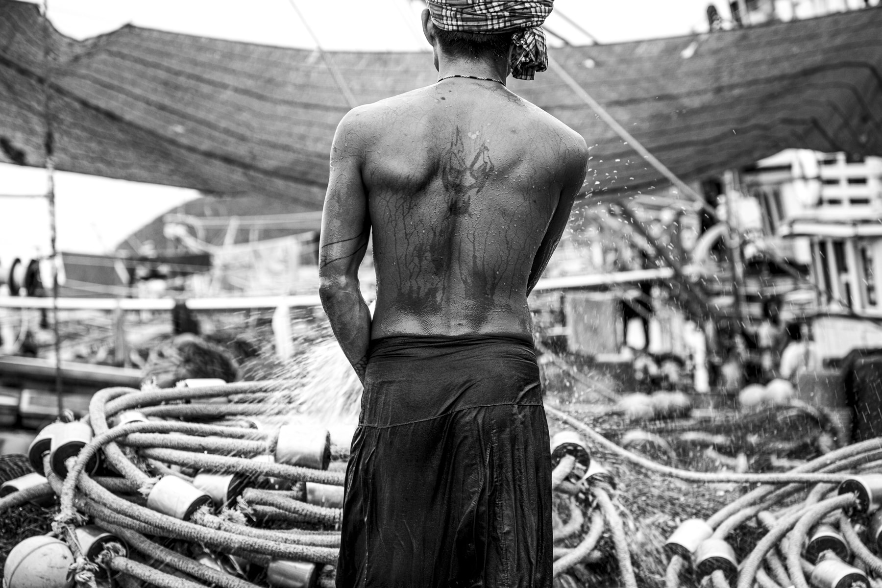 Hosing down a vessel in Thailand