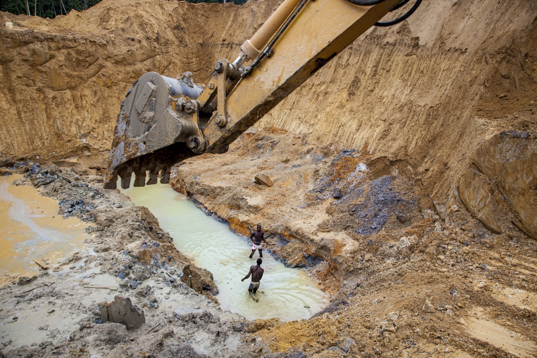 Excavator digging for gold in Ghana