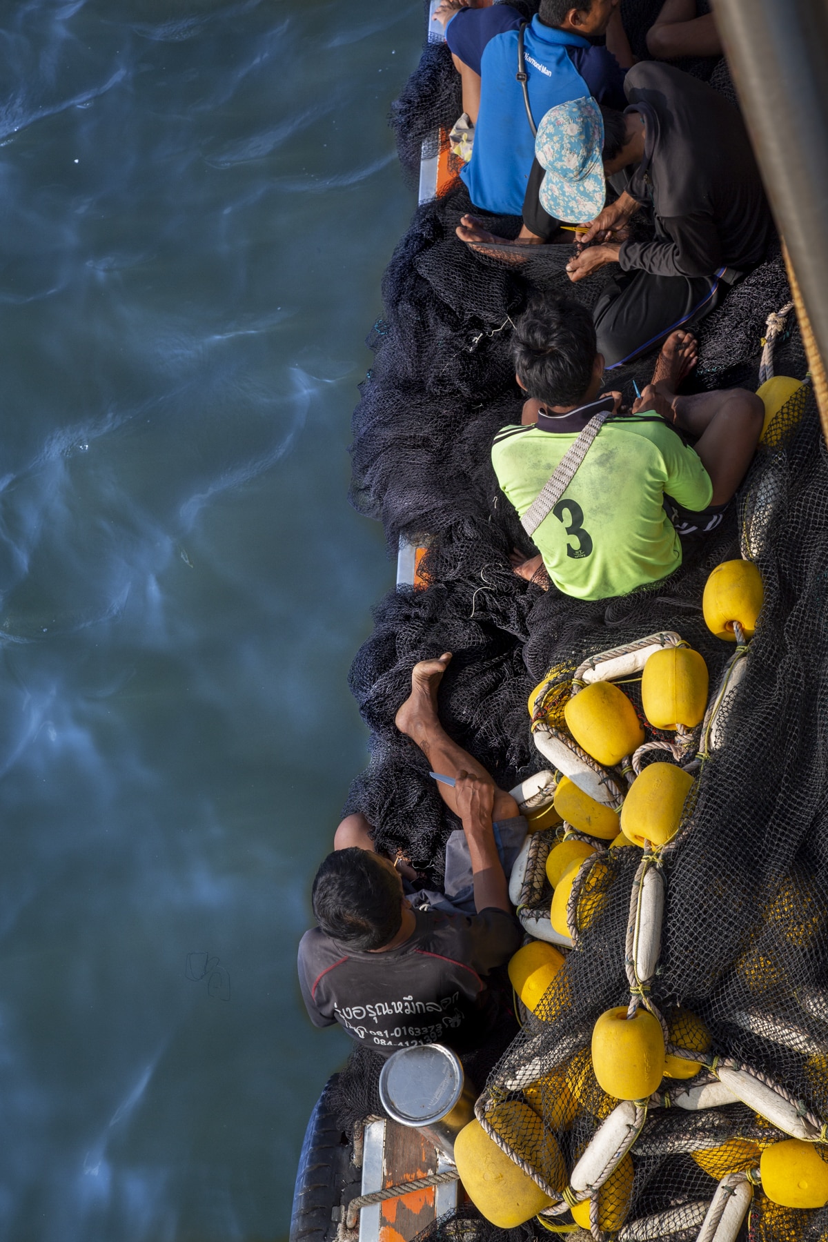 Group of men on the water in Thailand