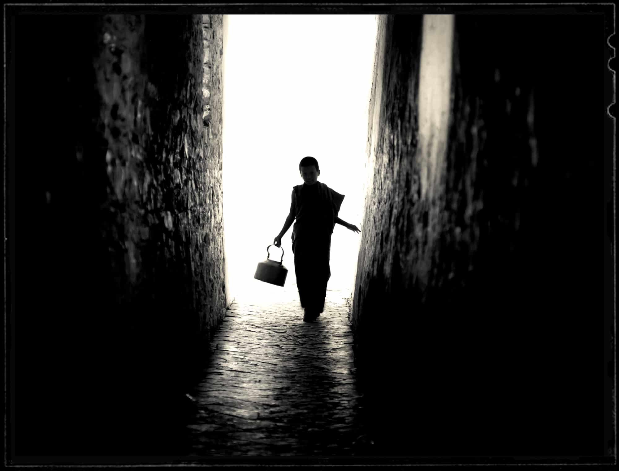 Young boy walking through a passage in Bhutan