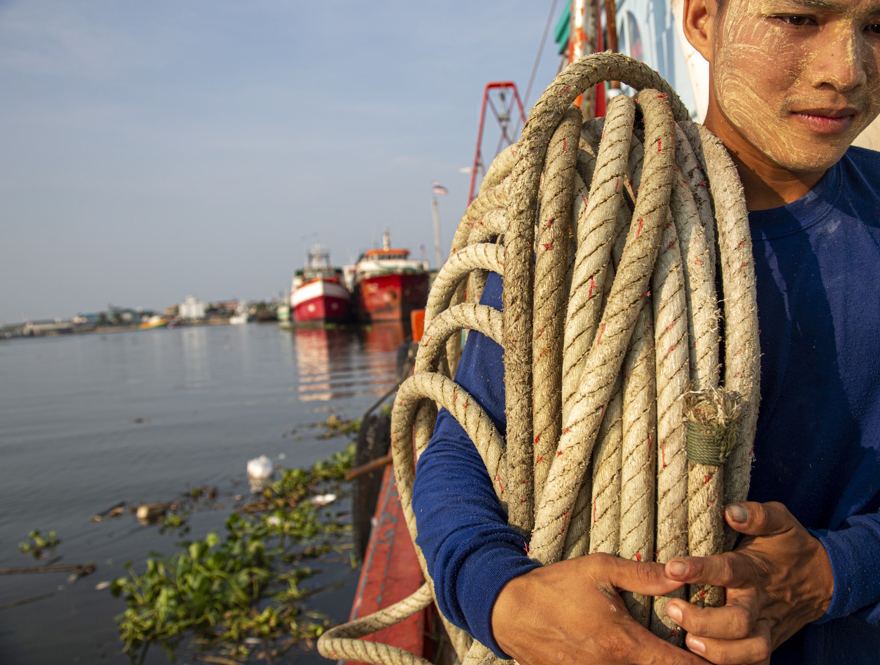 Man carrying a rope in Thailand