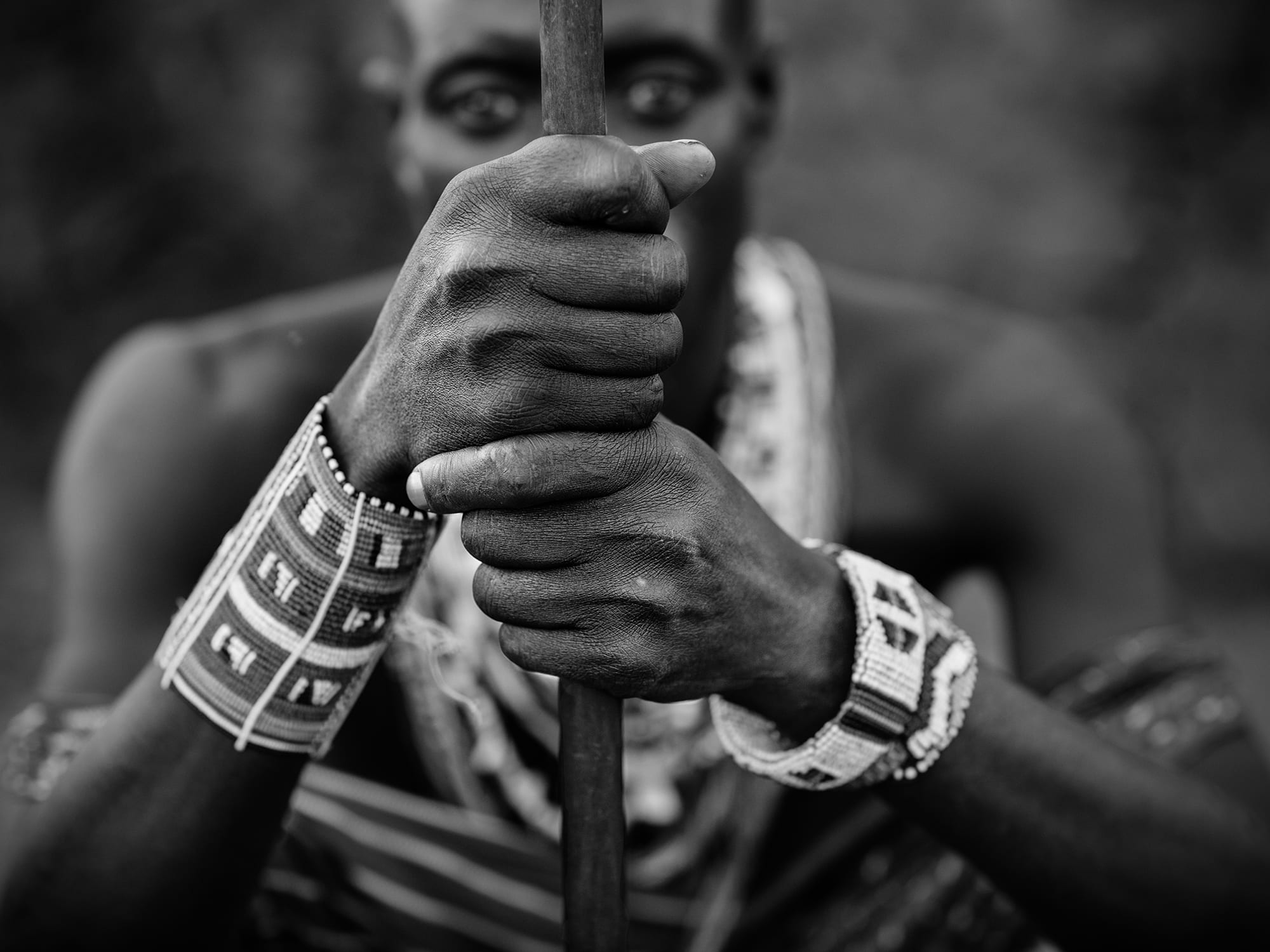 Man holding a walking stick in Kenya