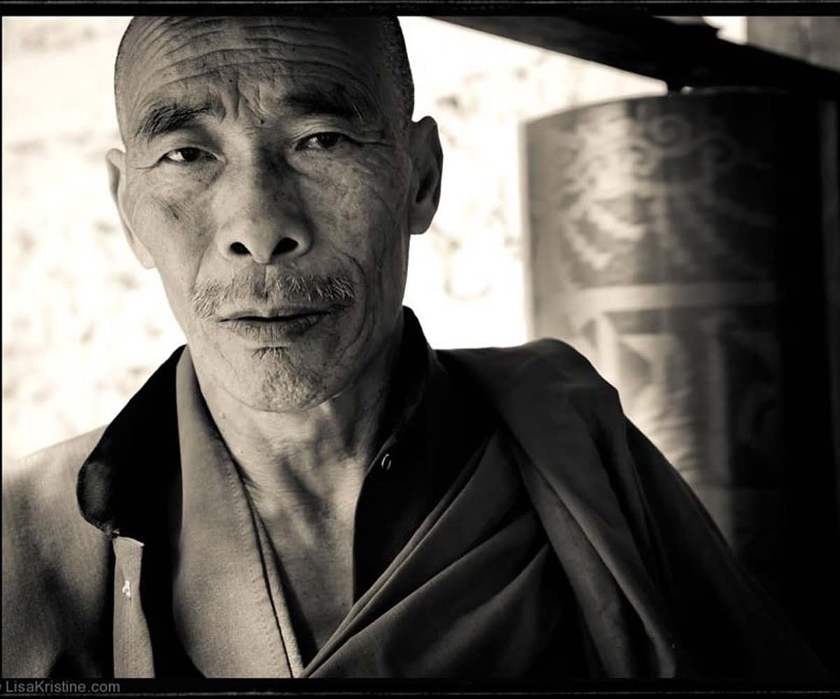 A man with wisdom looks in to the camera in Bhutan