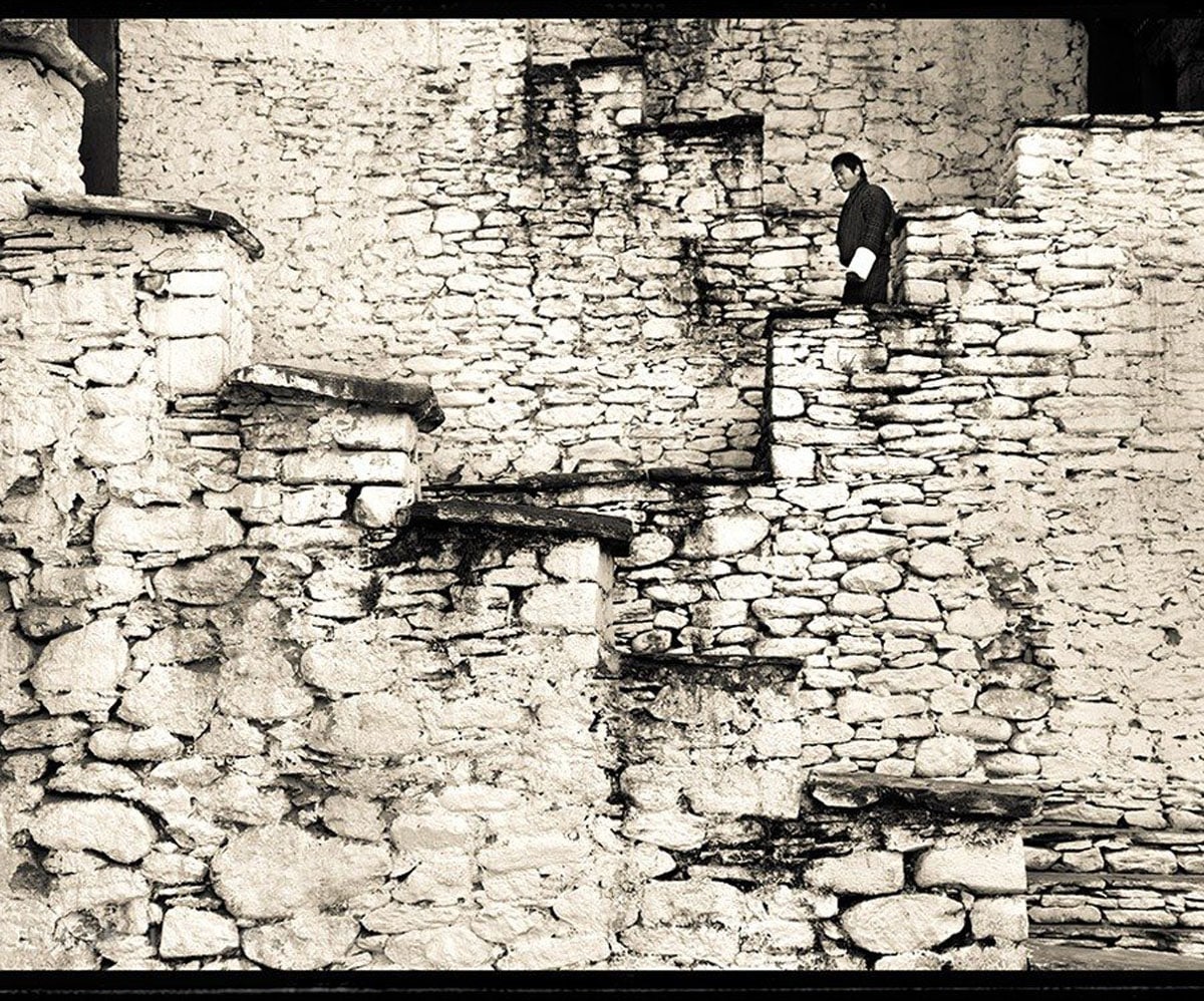 Man walking down a stairwell in Bhutan